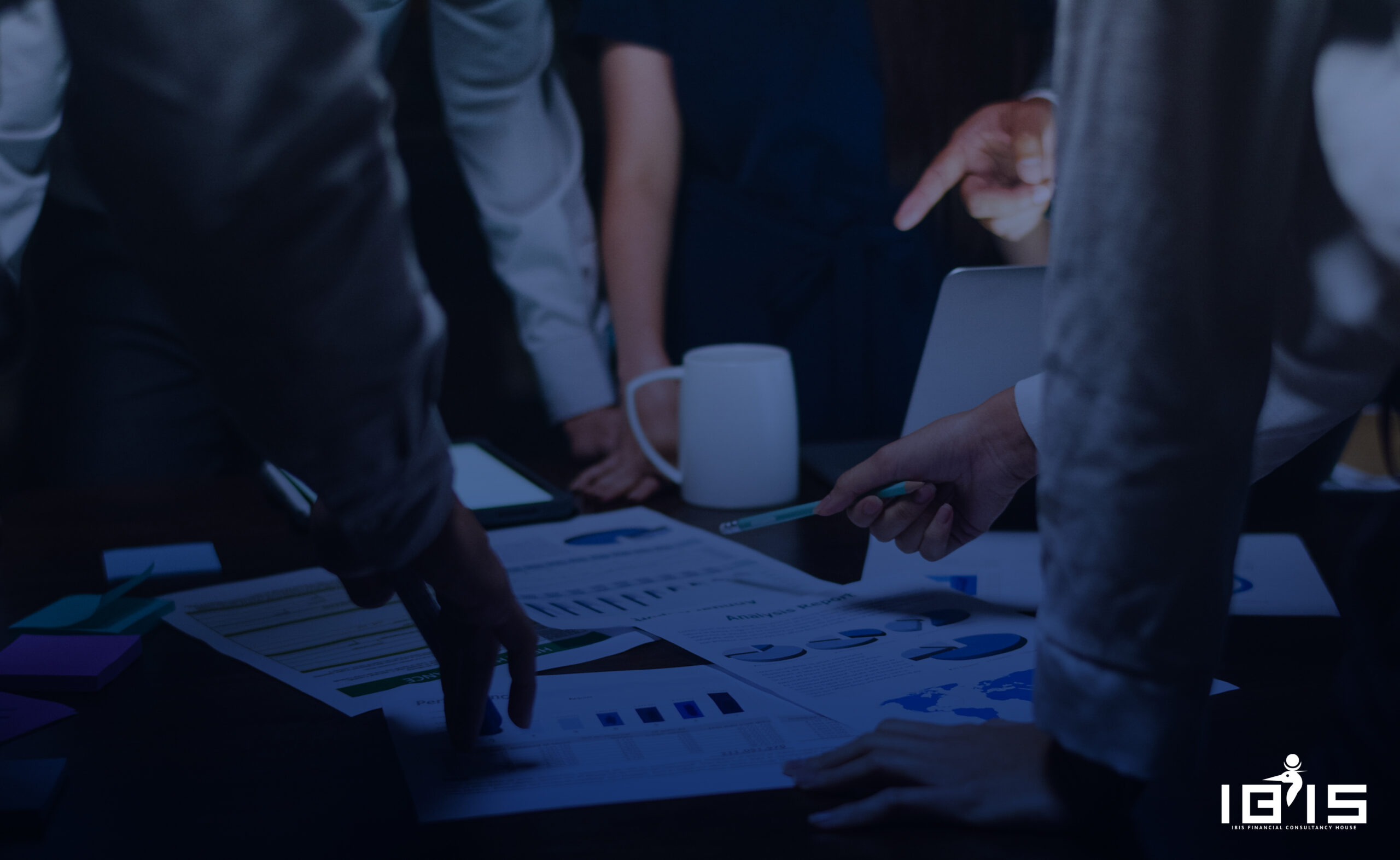 business and office concept - serious businessman showing others charts in office