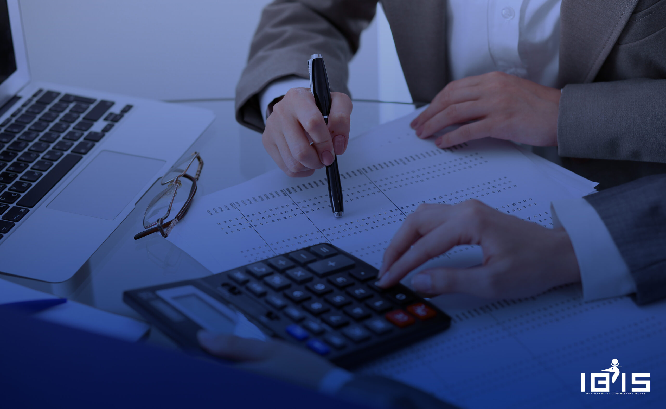 business and office concept - serious businessman showing others charts in office