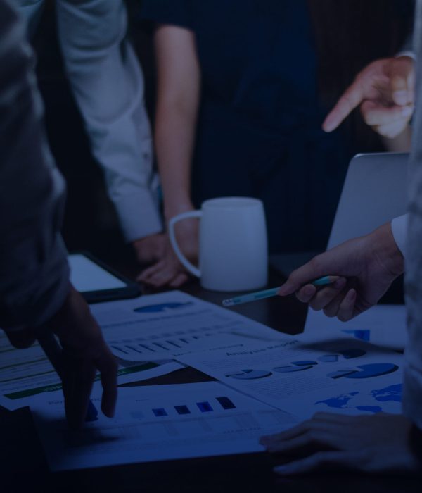 serious businessmen with papers in office business and office concept - serious businessman showing others charts in office